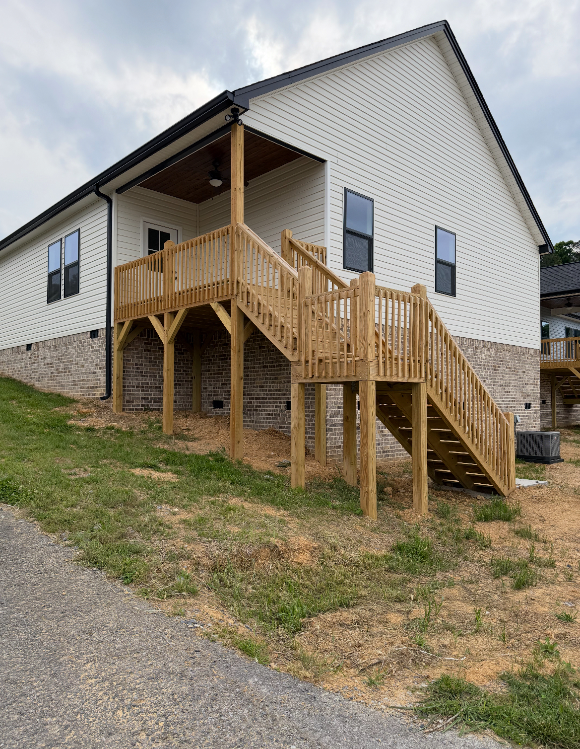 Custom-built elevated deck with covered porch and stair landing