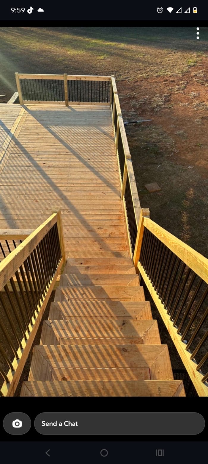 Deck staircase with black metal balusters